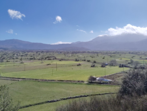 Panoramic view of the Lassithi Plateau mountains during a luxury private tour in Crete.